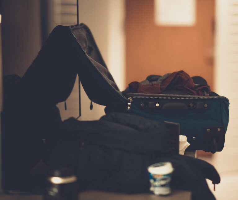 Carry-on suitcase packed for a minimalist trip