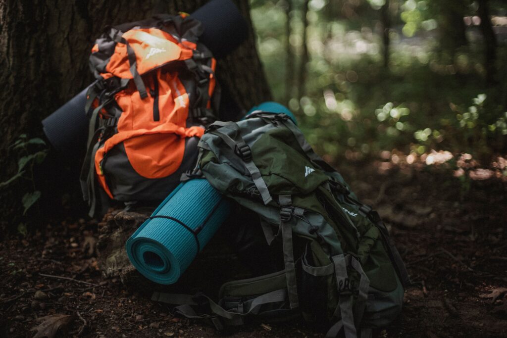 Hiking backpack resting on a trail before a day hike in the mountains